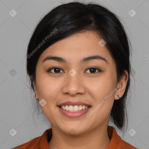 Joyful latino young-adult female with medium  brown hair and brown eyes