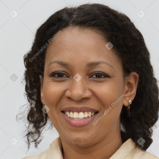 Joyful latino adult female with medium  brown hair and brown eyes