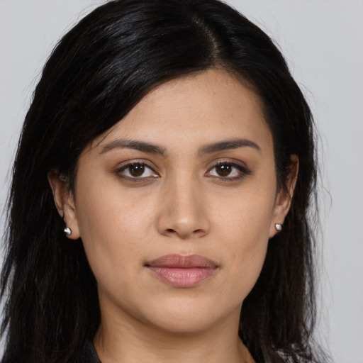 Joyful asian young-adult female with long  brown hair and brown eyes