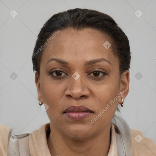 Joyful latino adult female with short  brown hair and brown eyes