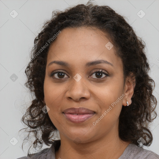 Joyful black young-adult female with medium  brown hair and brown eyes