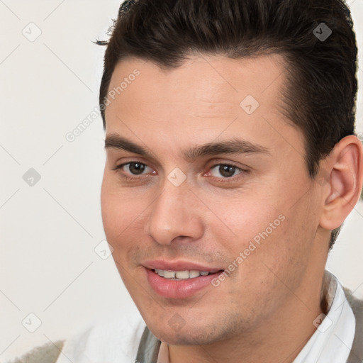 Joyful white young-adult male with short  brown hair and brown eyes