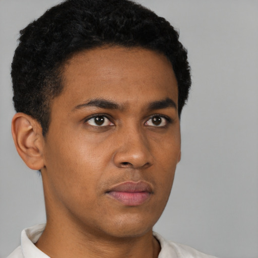 Neutral black young-adult male with short  black hair and brown eyes