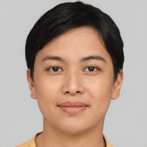 Joyful asian young-adult female with short  black hair and brown eyes