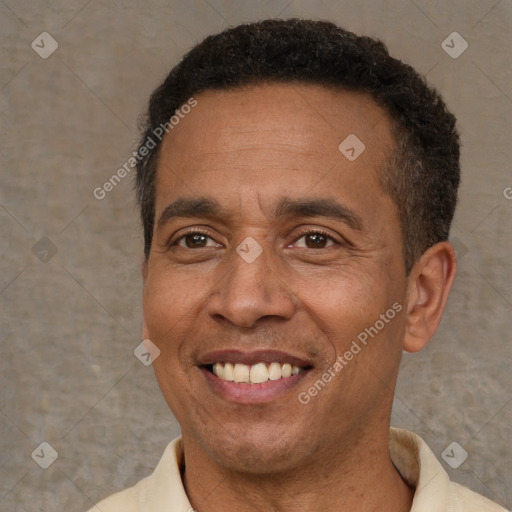 Joyful latino adult male with short  brown hair and brown eyes