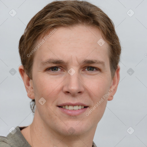 Joyful white adult male with short  brown hair and grey eyes