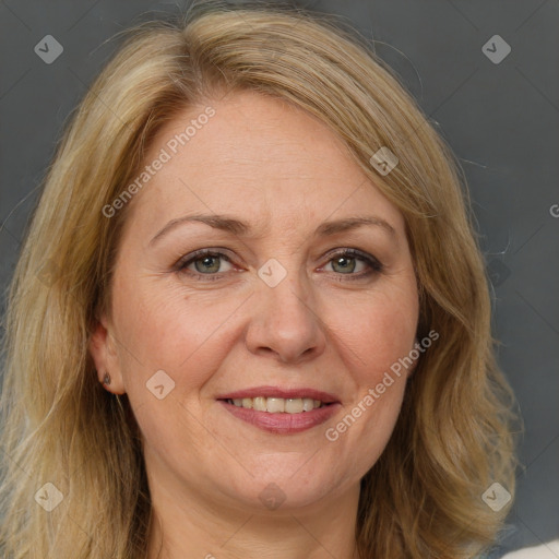 Joyful white adult female with long  brown hair and brown eyes