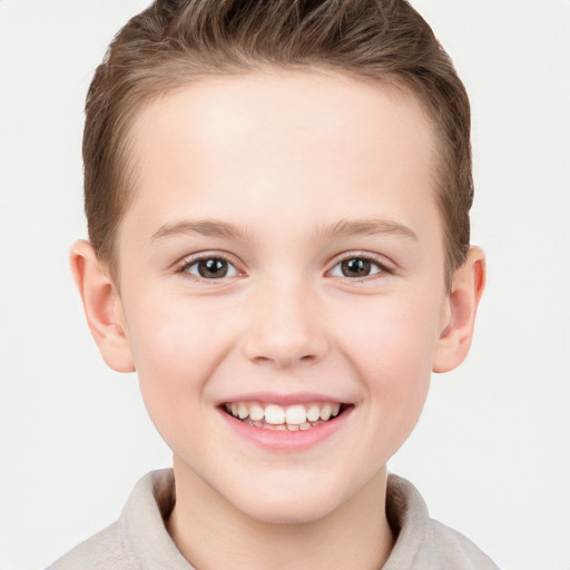 Joyful white child female with short  brown hair and grey eyes