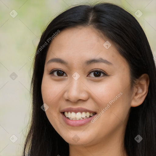 Joyful latino young-adult female with long  brown hair and brown eyes