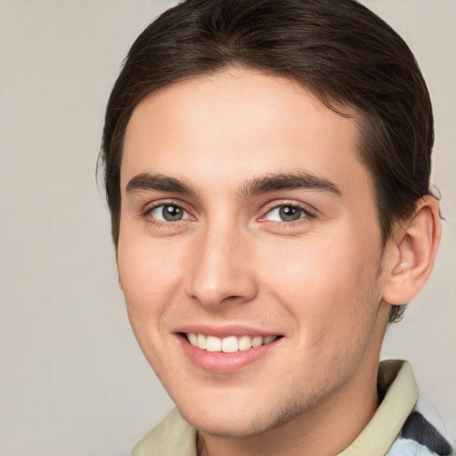 Joyful white young-adult male with medium  brown hair and brown eyes