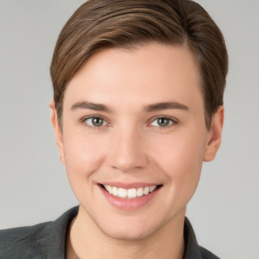 Joyful white young-adult female with short  brown hair and grey eyes