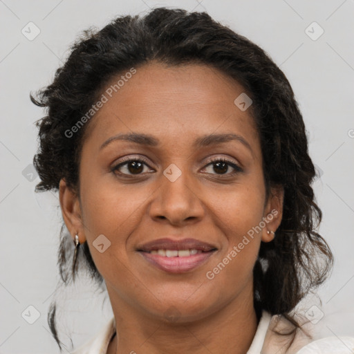 Joyful latino adult female with medium  brown hair and brown eyes