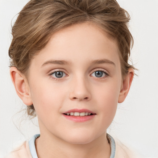 Joyful white child female with short  brown hair and grey eyes