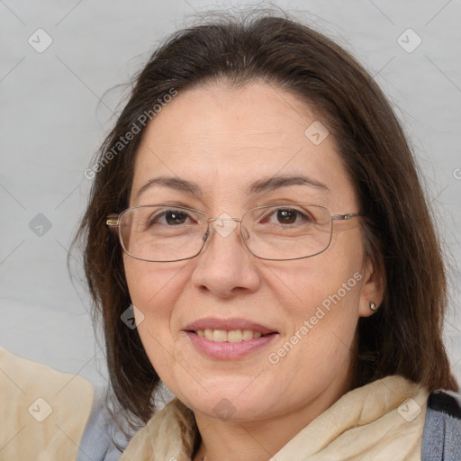 Joyful white adult female with medium  brown hair and brown eyes