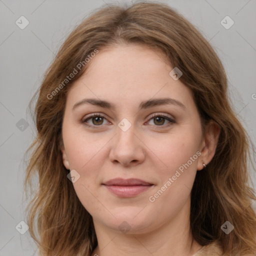 Joyful white young-adult female with medium  brown hair and green eyes