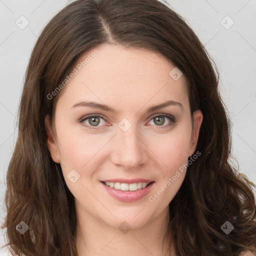 Joyful white young-adult female with long  brown hair and green eyes