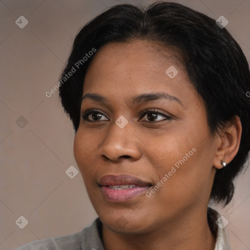 Joyful black young-adult female with medium  brown hair and brown eyes