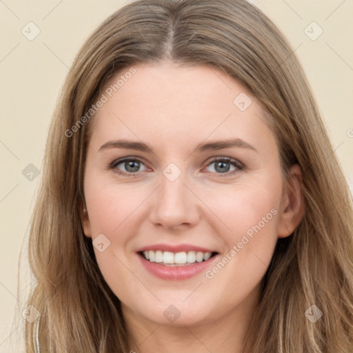 Joyful white young-adult female with long  brown hair and green eyes