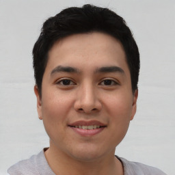 Joyful asian young-adult male with short  black hair and brown eyes