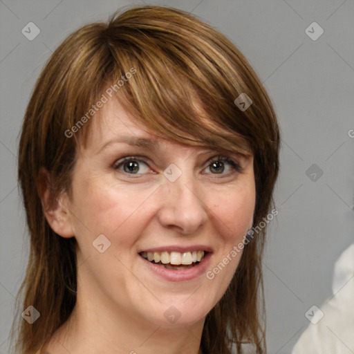 Joyful white adult female with medium  brown hair and grey eyes