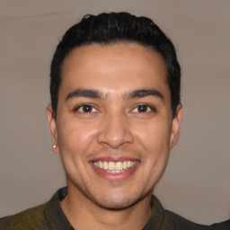 Joyful white young-adult male with short  black hair and brown eyes