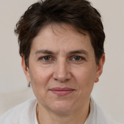 Joyful white adult female with short  brown hair and brown eyes