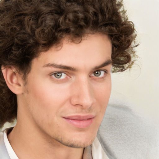 Joyful white young-adult male with medium  brown hair and brown eyes