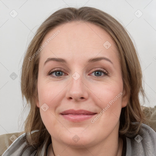 Joyful white young-adult female with medium  brown hair and blue eyes