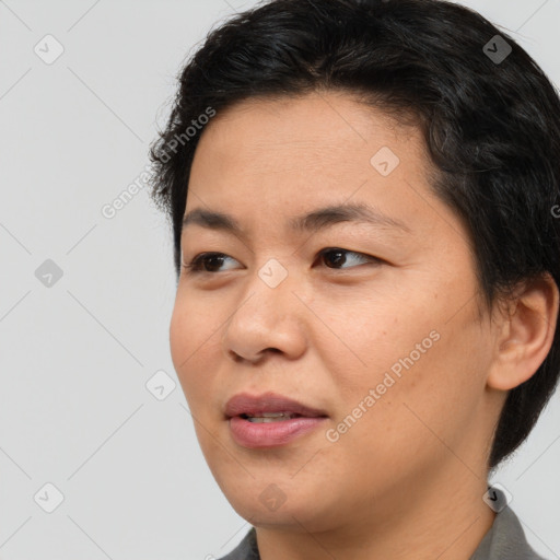 Joyful asian young-adult female with short  brown hair and brown eyes