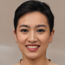 Joyful asian young-adult female with short  brown hair and brown eyes