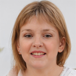 Joyful white child female with medium  brown hair and blue eyes