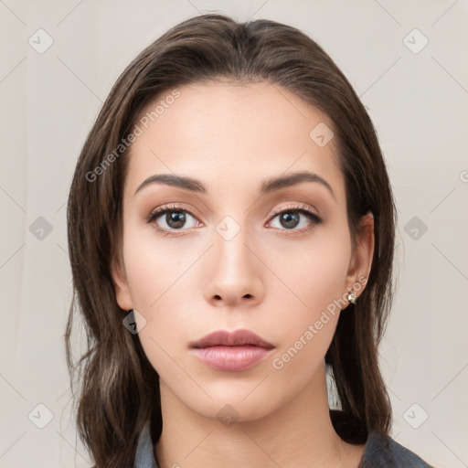 Neutral white young-adult female with medium  brown hair and brown eyes