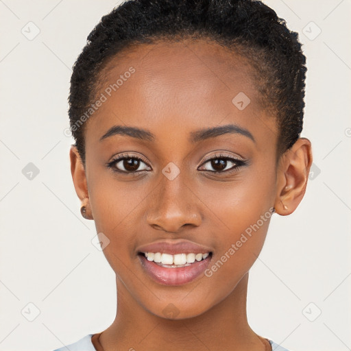 Joyful black young-adult female with short  brown hair and brown eyes