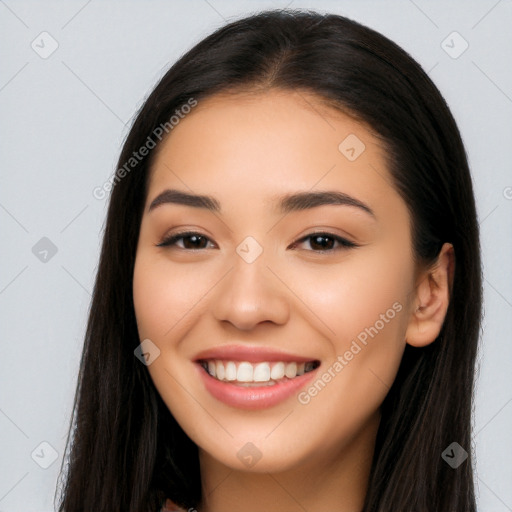 Joyful latino young-adult female with long  brown hair and brown eyes