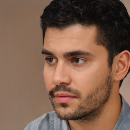 Neutral white young-adult male with short  black hair and brown eyes
