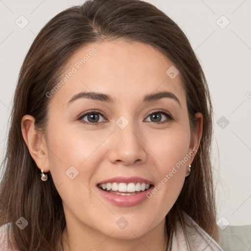 Joyful white young-adult female with long  brown hair and grey eyes