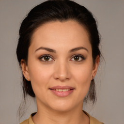 Joyful white young-adult female with medium  brown hair and brown eyes