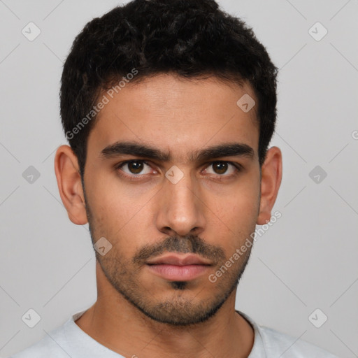 Neutral latino young-adult male with short  brown hair and brown eyes