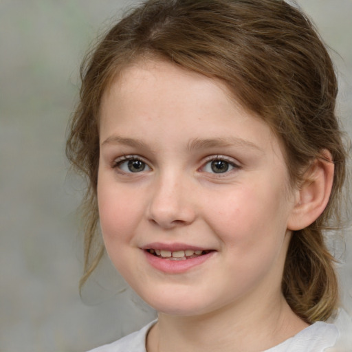 Joyful white child female with medium  brown hair and brown eyes