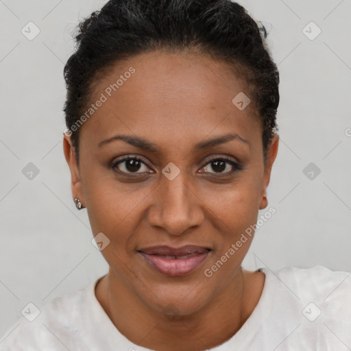 Joyful latino adult female with short  brown hair and brown eyes