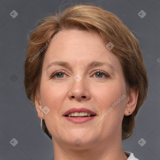 Joyful white adult female with medium  brown hair and grey eyes