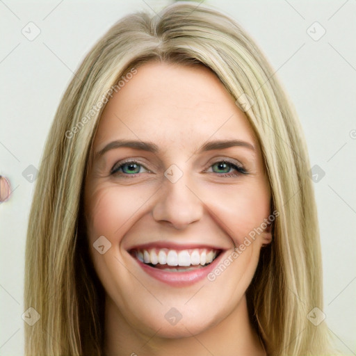 Joyful white young-adult female with long  brown hair and green eyes