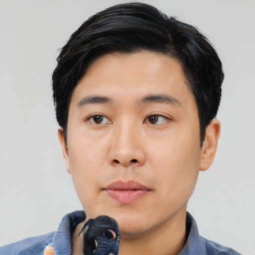 Neutral asian young-adult male with short  black hair and brown eyes