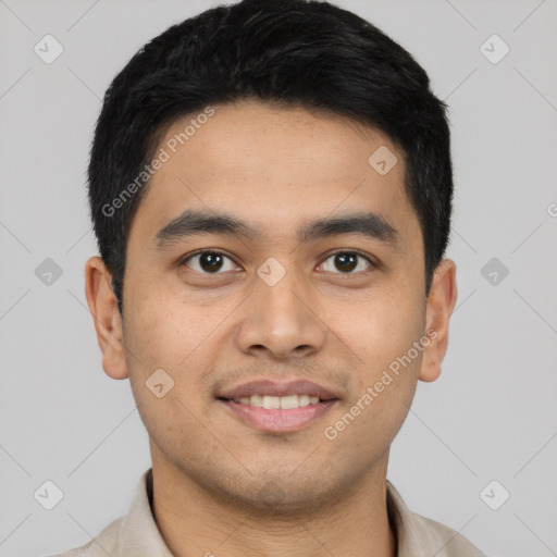 Joyful latino young-adult male with short  black hair and brown eyes