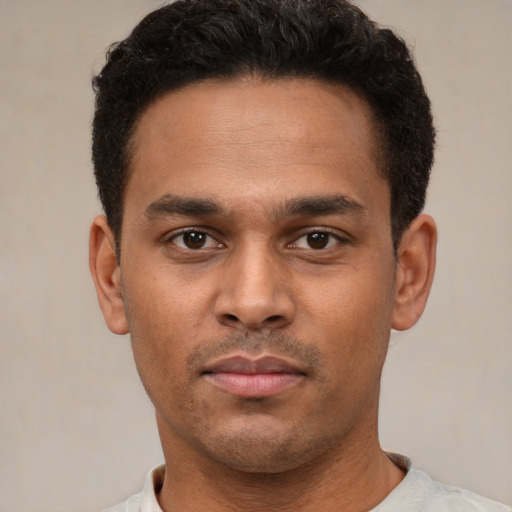 Neutral latino young-adult male with short  brown hair and brown eyes