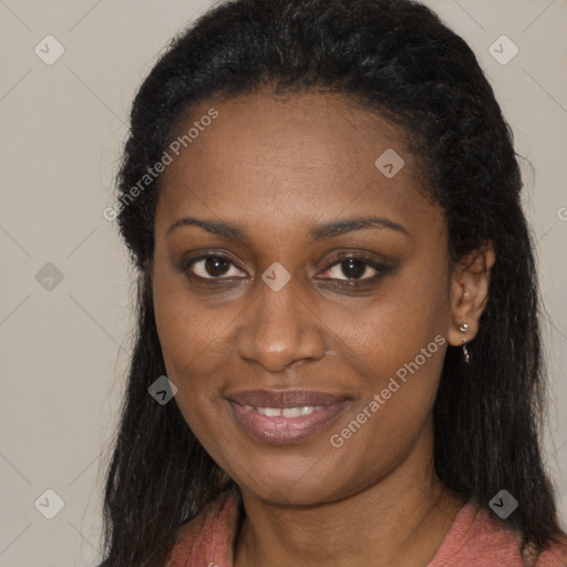 Joyful black young-adult female with long  brown hair and brown eyes