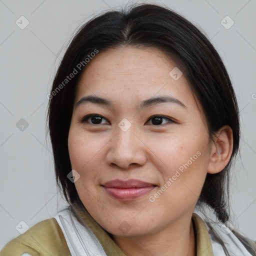 Joyful asian young-adult female with medium  brown hair and brown eyes