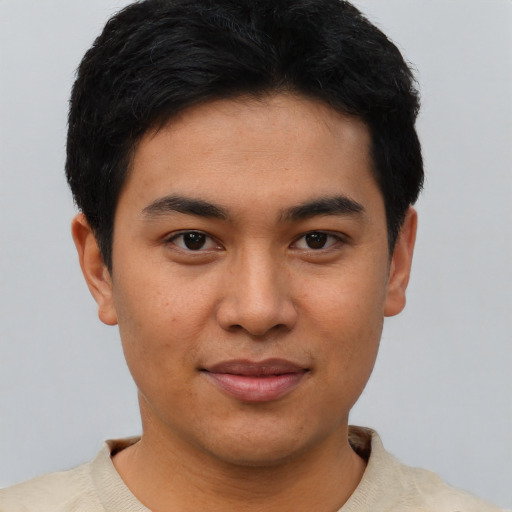 Joyful asian young-adult male with short  black hair and brown eyes