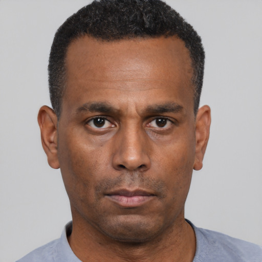 Neutral black adult male with short  black hair and brown eyes