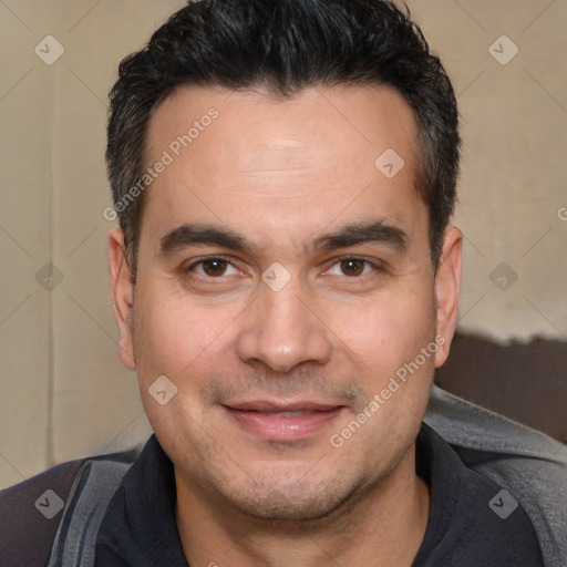 Joyful white adult male with short  black hair and brown eyes